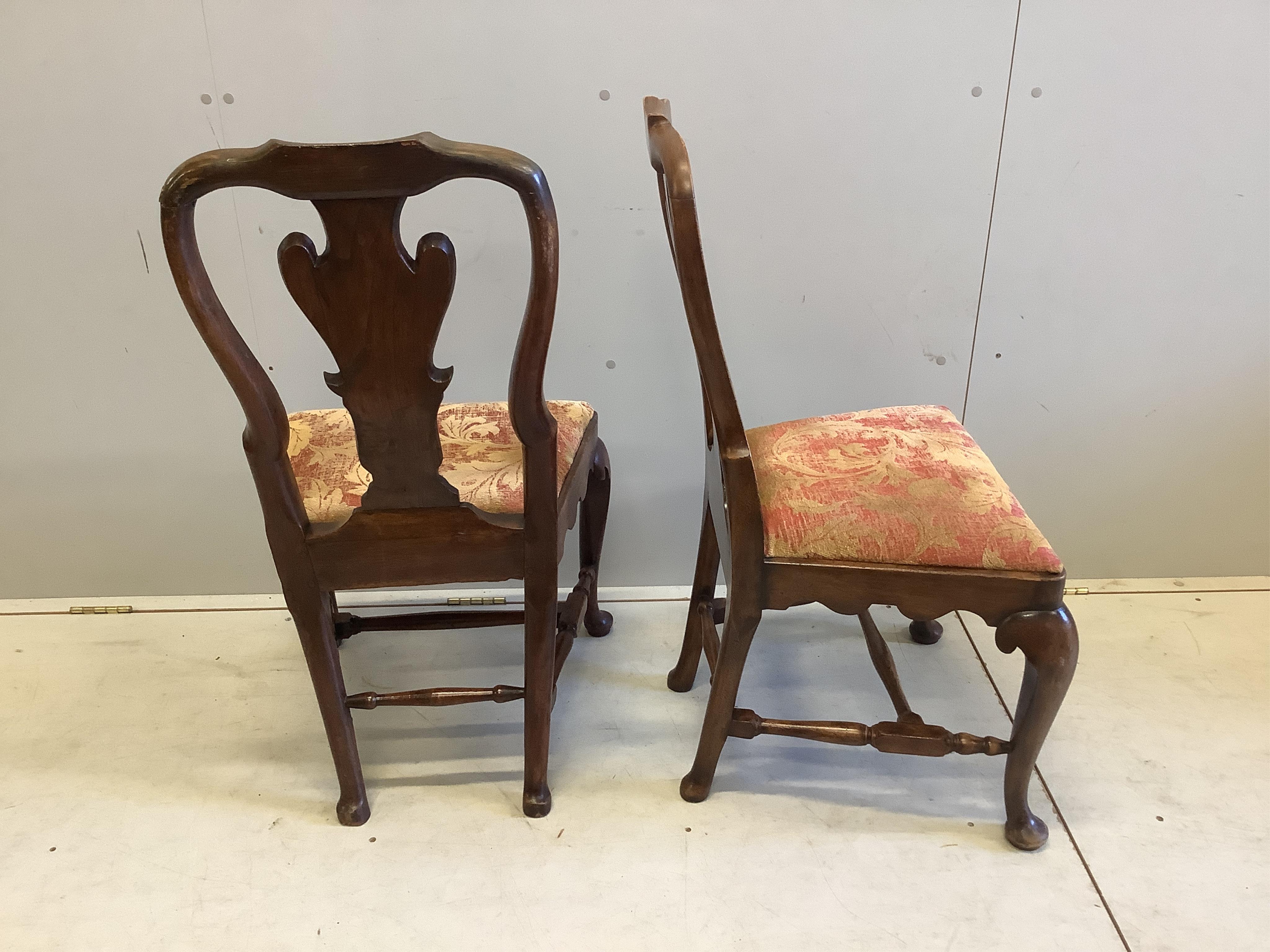 A pair of 18th century walnut dining chairs, width 52cm, depth 42cm, height 96cm. Condition - fair